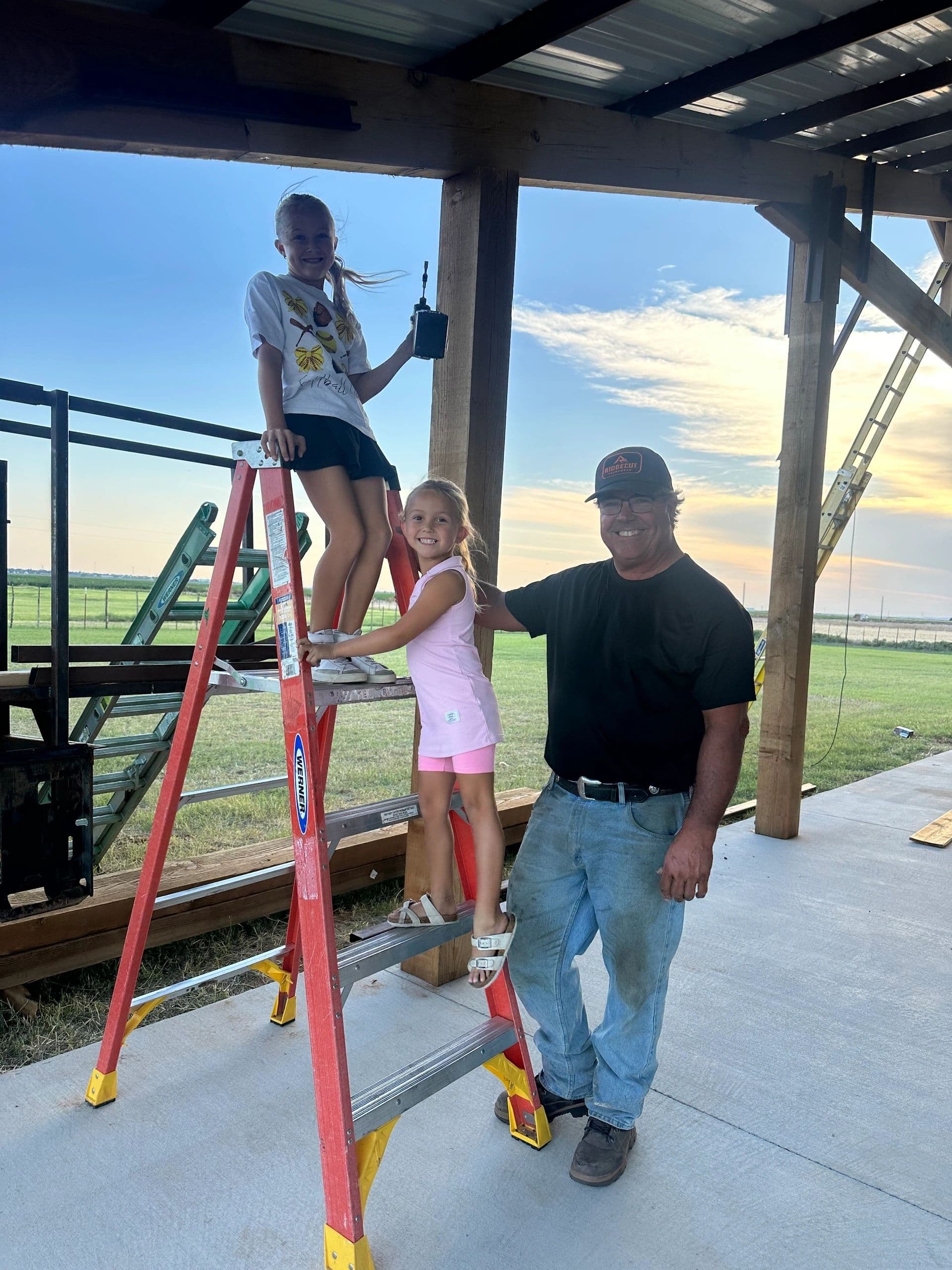 Edward with his family at the job site